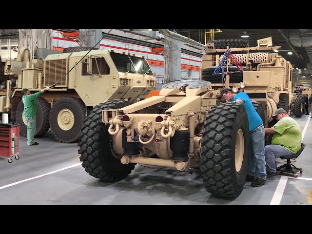 Inside Factory Building US Army Massive Armored Trucks class=