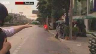 BBC reporter dodges fireworks - Bangkok