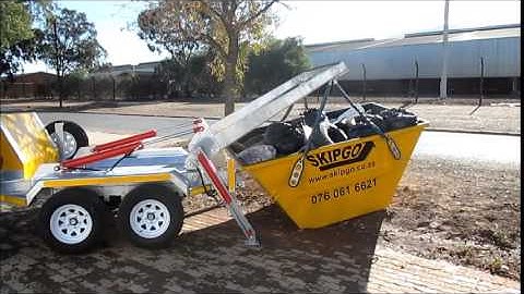 Superior loading of a mini skip by a Skipgo agent. Manufactured by SkipRent.(www.skiprent.co.za)