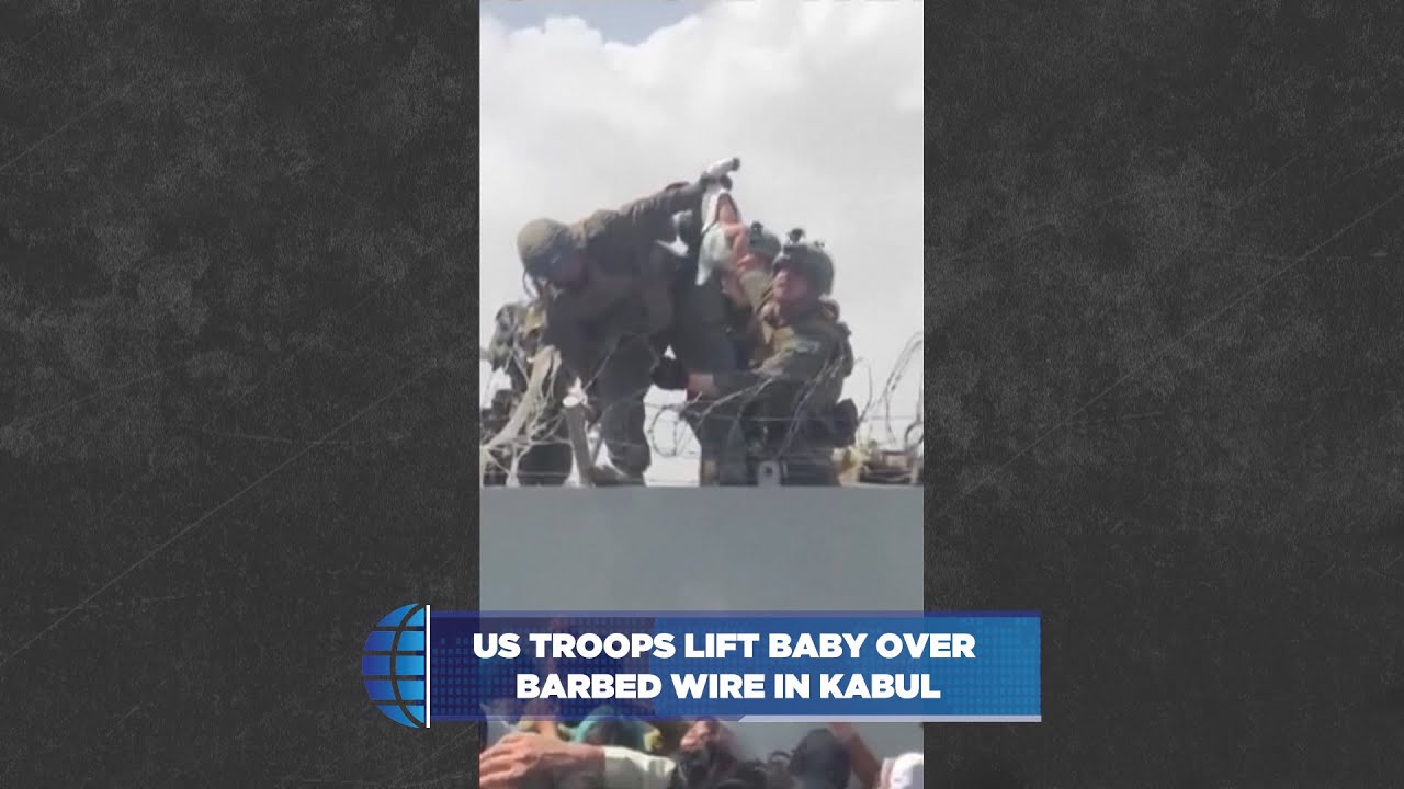 US Troops Lift Baby Over Barbed Wire in Kabul