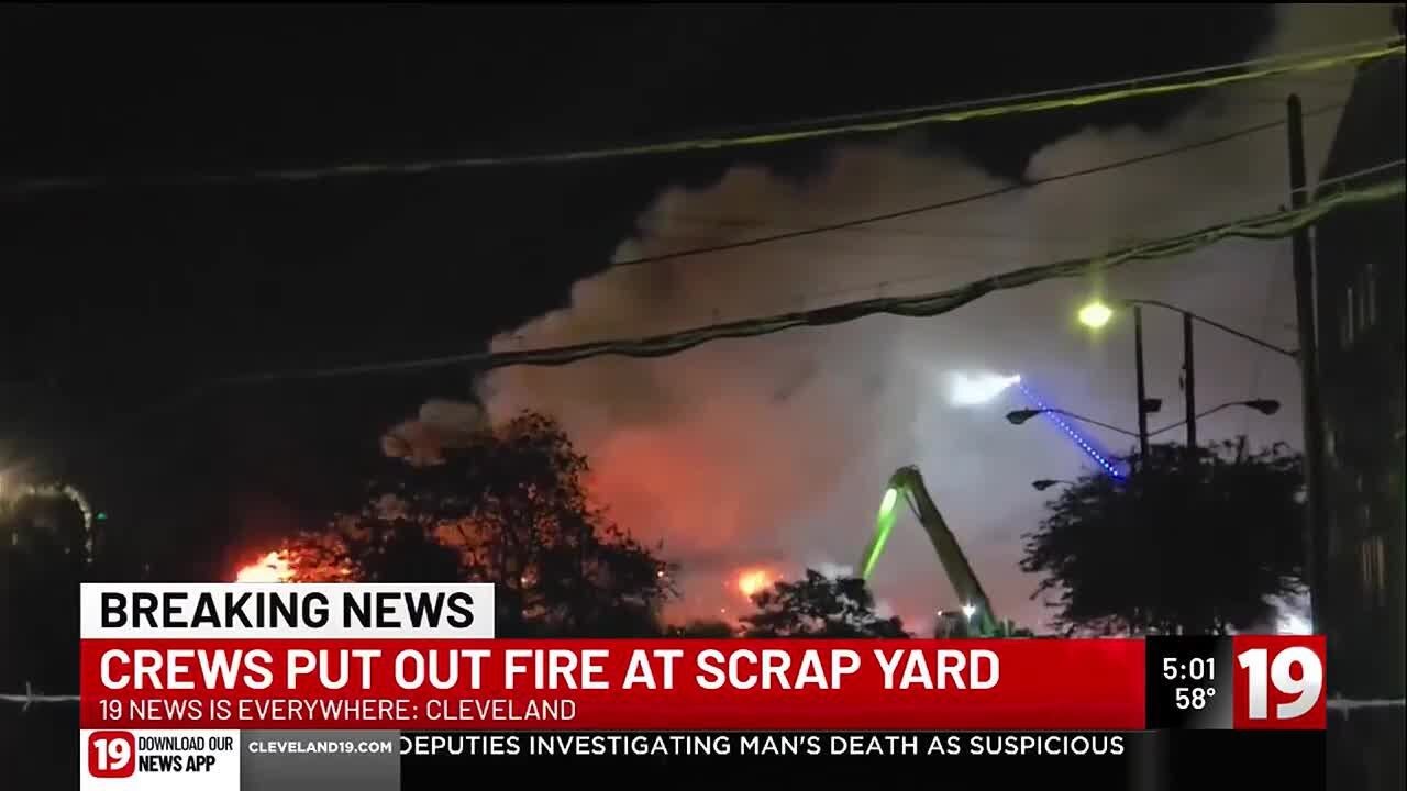 Crews put out fire at scrap yard - YouTube