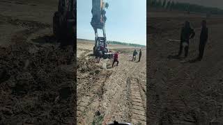 The Process Of Pulling Out A Tractor Stuck In Mud- Good Tools And Machinery Make Work Easy