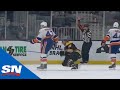 Leo komarov drops david pastrnak with the butt end of his stick