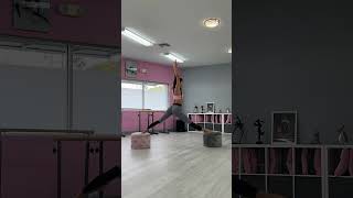 Girl Uses Two Poufs To Pull a Gymnastic Front Split