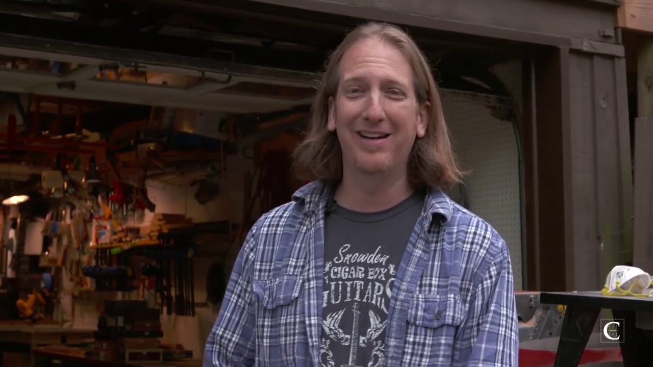 Mike Snowden builds and plays a cigar box guitar