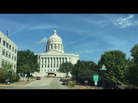 Driving in Jefferson City. Downtown, the Missouri River, homes, the capitol, and prison.