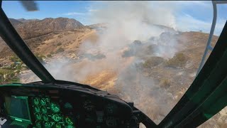 Behind the scenes look in the sky: Chopper drops water on Harbison Fire