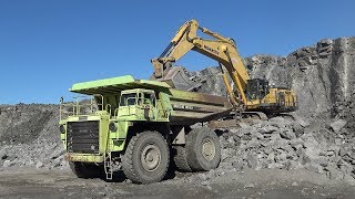 4K| Komatsu PC1250 Loading 2x Euclid R130 Dumpers With Rocks In A Quarry