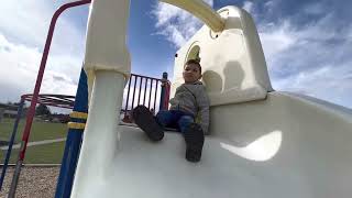 John enjoying playground fort and white slide  at Brighouse park. April 1st/2023.