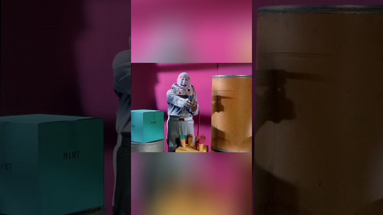 Mr. Freeze shoots Batman and Robin with his Freeze Gun.