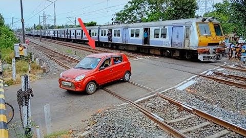Almost Out Of Danger : Red Car About To Get Hit By Furiously Moving Aerodynamic EMU Local