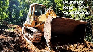 Land Clearing I Rough grade on boundary road with the CAT 963