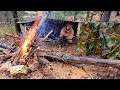 Heavy rain  muddy overnight tarp camping  building a fire in extremely wet conditions