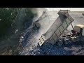 Wow! After the land slid, a 25-ton dump truck filled it back up by loading stones using Komatsu Shan