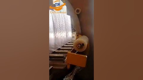 Horizontal orbital stretch wrapping machine