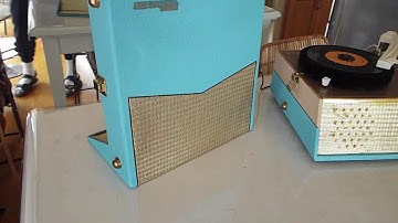 RCA STEREO portable record player playing a 45 RPM record