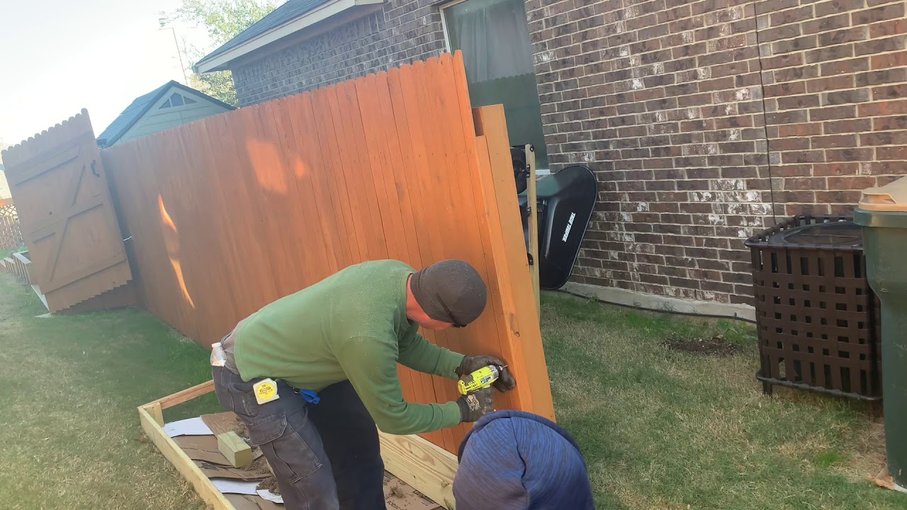 Cleaning up and installing a fence section