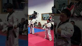 Taekwondo black testing with nunchuk