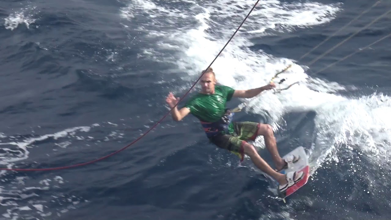 Kite surfer Ross Harte jumps the height of our mast holding halyard!