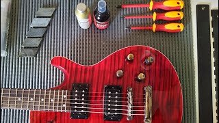 Setting Up a CHEAP GUITAR, Plastic Vs. Bone Nut