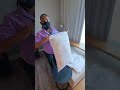 Putting on pillow cases.
