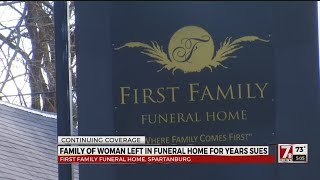 Family of woman left in funeral home for years sues