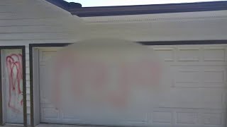 Racial slurs spray-painted on home, cars