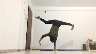 One arm handstand - straddle walk