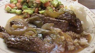 Ingredients: cubed steak cut in 1" strips (4 pieces) 1 large onion 2
green bell peppers heaping tablespoon cornstarch 1/3 cups of water 3
tablespoons ter...