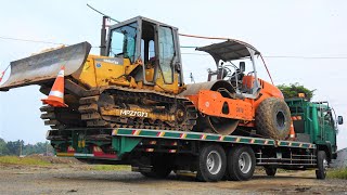 Soil Compactor And Bulldozer Transport With Fuso Self Loader Truck