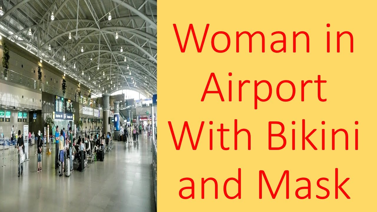 Woman in Airport With Bikini and Mask Video Woman Struts Through Airport Wearing Bikini and