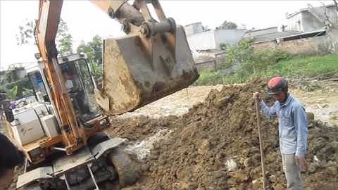 Máy xúc đóng cọc