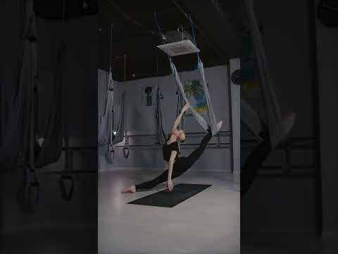 woman doing aerial yoga