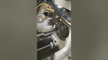 Setting a guide bushing on a Tsugami Swiss lathe.