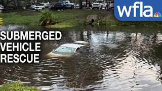 Body camera video shows officers rescuing woman from car sinking in Clearwater pond