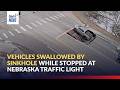 Vehicles swallowed by sinkhole while stopped at Nebraska traffic light | GMA Integrated News
