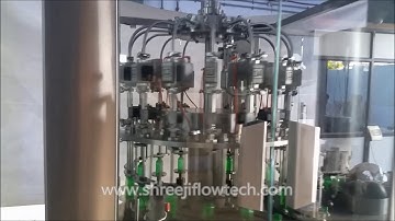 16x8 FLOW METER BASED ROTARY FILLING & CAPPING MACHINE - Shreeji Flowtech Systems