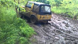 Suzuki SJ 410 on a muddy hill
