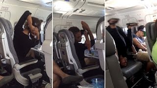 Woman does yoga upside down on an airplane   and she doesn't even wake up her neighbor