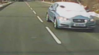 Motorist uses 'peephole' in snow-covered windscreen