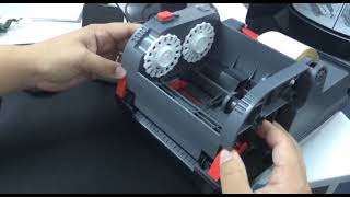 картинка: Как заправлять бумагу в принтер этикеток Honeywell PC42