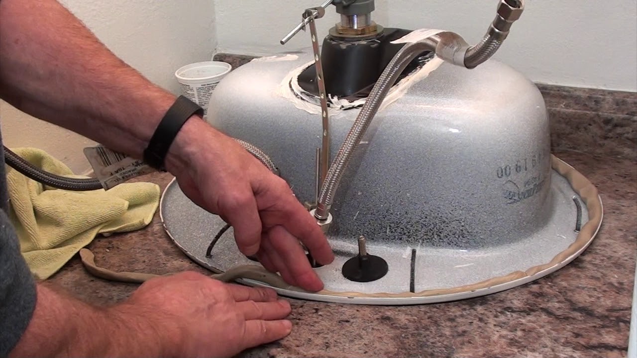 removing dried caulk from bathroom sink