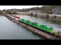 Awesome 4k view of a sweet lashup long freight train cn 594 west crossing lake at brookville nb