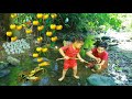 Mother with son catch crab in water found egg with pick Fruits eat - cooking food for dog