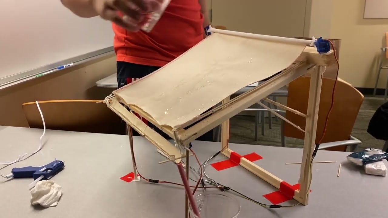 BRain demo - BRain automatically deploys if  rain is detected with humidity readings, stretching out a canvas that catches rain and directs it down to a water collection tan
