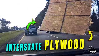 Broken Plywood Flies at a Car on the Interstate Road