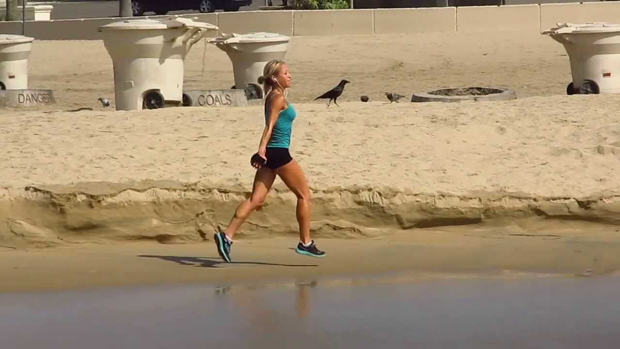 SUPER FIT GIRL RUNNING THE BEACH IN 