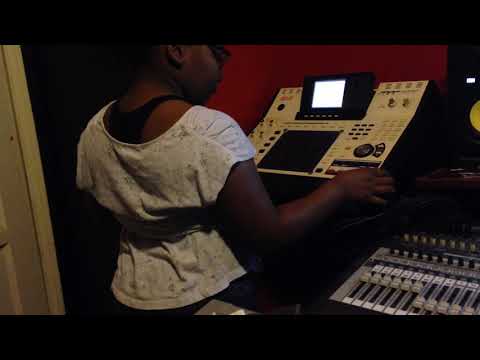 A 9 year old girl making a beat on a MPC 4000