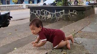 Baby crawling on the side of highway