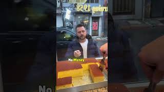 The shopkeeper gives the cake to him